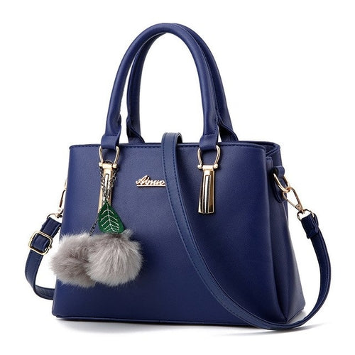 Designer Handbag with Ball Tassel