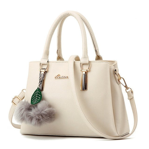 Designer Handbag with Ball Tassel